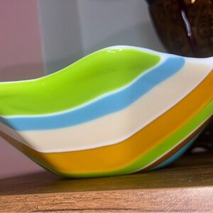 Bowl big blue brown lime green orange tan. White inside. 11 1/2 inch no flaws. ￼